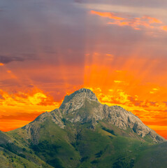 Fototapeta premium alone mount top on the red dramatic sunset background