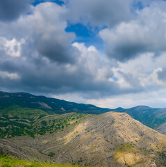 mountain valley under a dense cloudy sky