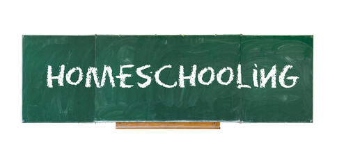 Homeschooling. Word Homeschooling writing on old green blackboard isolated on white background