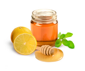 Jar of honey and lemon isolated on white background.