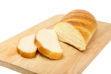 A loaf of white bread with two slices cut off lies on a wooden Board. Isolation.