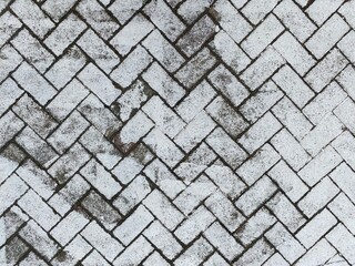 Inter-connected White Painted Floor Bricks.