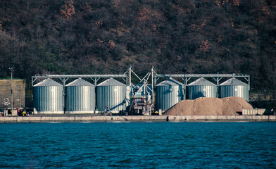 Silos for storing grain. They are located on the waterfront