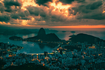 Fototapeta premium Skyline panorama of Rio de Janeiro at sunrise, Brazil. Sugarloaf Mountain and Botafogo Bay