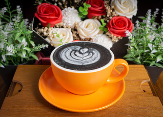 a cup of coffee latte with 
charcoal flavor