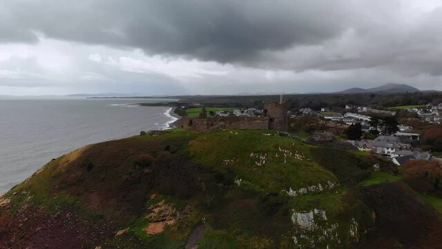 Parallax drone shot of gorgeous Castell Cricieth