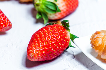 Fresh strawberries and croissant backdrop.