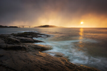 Storm and sun over little islands in northern Norway