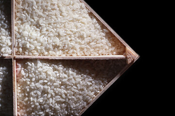 A set of grain cereals. Rice, buckwheat and millet groats in a wooden tray. A grocery set of...