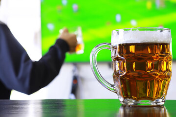 Glass of fresh beer on a wooden table. Lager beer mug on stone table. Top view with copy space