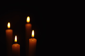 Burning candle Wick from a candle in a flame of fire. Symbol of sadness and loneliness. A time of condolences. Burning wax candle. Religion.