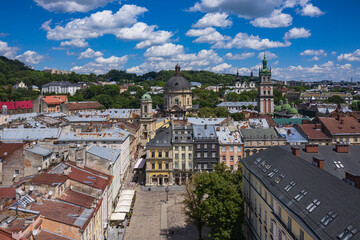Fototapeta na wymiar Aerial view on Market square, Dormition, Dominican and Carmelite Church in Lviv, Ukraine from drone