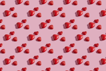 Valentine's Day pattern with candy hearts on a pink background