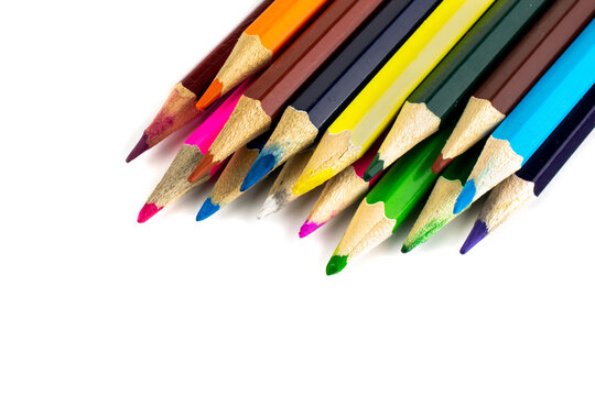 colored pencils with visible details on a white background