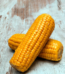 Corn cob surrounded by rustic background
