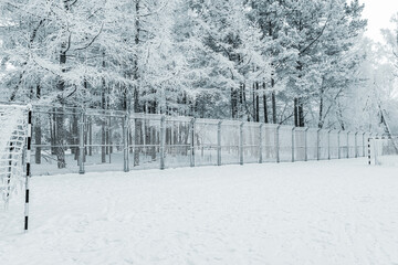 An empty soccer field on a frosty winter day