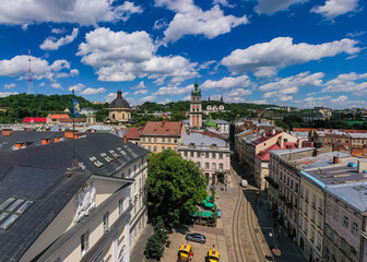 Aerial view on Market square, Dormition, Dominican and Carmelite Church in Lviv, Ukraine from drone