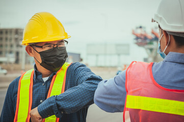 Two worker shake hand elbow prevention covid19 coronavirus, Man wear face mask