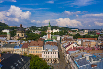 Obraz premium Aerial view on Market square, Dormition, Dominican and Carmelite Church in Lviv, Ukraine from drone