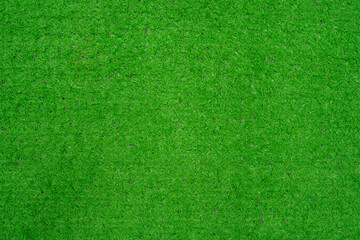 Thai native fan made from bamboo weave colorful isolated on green artificial grass.