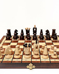 Chess pieces on a wooden board