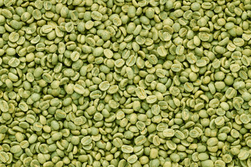 Green coffee beans top view background