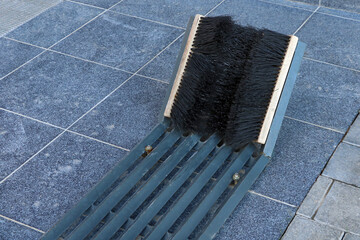 Close-up of a shoe brush when entering a house or building.