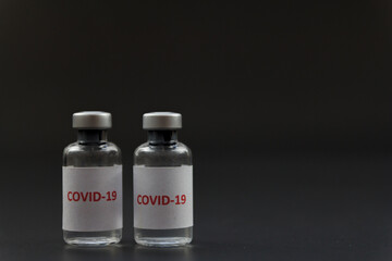 Corona virus vaccine in bottles. The medical concept.