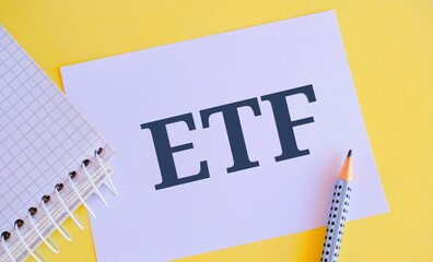 ETF text written on white paper. Concept meaning Marketable security that tracks a stock index.