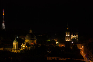 Fototapeta na wymiar Aerial view on Dormition, Dominican and Carmelite Church in Lviv, Ukraine at night from drone