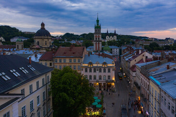Fototapeta premium Aerial view on Market square, Dormition, Dominican and Carmelite Church in Lviv, Ukraine from drone