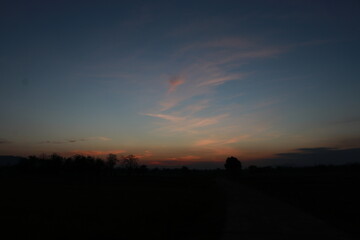 Obraz premium The Orange light of Sunrise ,silhouette and blue sky in the morning