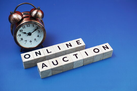 Online Auction alphabet letter with alarm clock on blue background