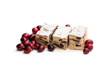 Christmas stollen slices with cranberry with icing sugar isolated on white