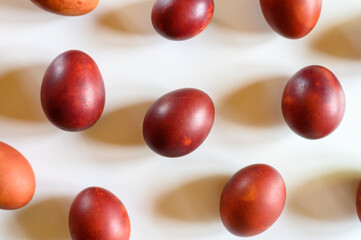 easter eggs painted onion husks on a white background. coloring the eggs according to the old natural eco-friendly method with peeled onions