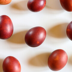 easter eggs painted onion husks on a white background. coloring the eggs according to the old natural eco-friendly method with peeled onions. square