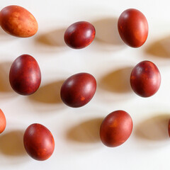 easter eggs painted onion husks on a white background. coloring the eggs according to the old natural eco-friendly method with peeled onions. square