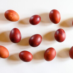 easter eggs painted onion husks on a white background. coloring the eggs according to the old natural eco-friendly method with peeled onions. square