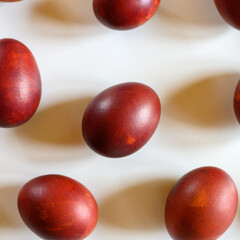 easter eggs painted onion husks on a white background. coloring the eggs according to the old natural eco-friendly method with peeled onions. square