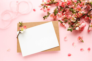 mockup greeting card. spring composition. blooming branch of azalea and envelope for text. congratulation. invitation