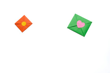 Green and orange envelope isolated on a white background. Valentine's day gift. Valentine's day concept. Space for text.