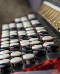 Buttons bayan close-up.Black and white keys of an accordion close up. Selective focus.