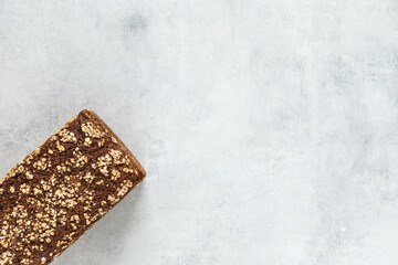 Wholegrain bread on a grey concrete background