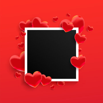 Empty black photo frame with many red sweet love hearts shape on red background.