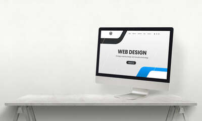 Web design studio desk with computer display and promo web page on it. Development team promotion concept