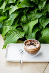 Coffee with ice cream in glass cup outdoor
