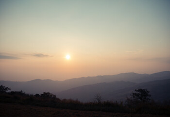 Sunrise over the mountain range at the north of thailand - 404013711