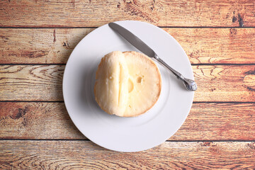 Extremadura cheese (Torta del Casar) on wooden table