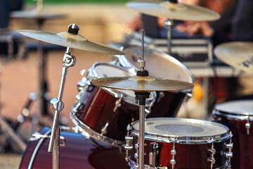Drum set. Percussion musical instruments on a city street. Close-up