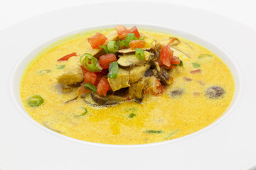 Low carb Curry soup with chicken, coconut milk, champignons, and chilli pepper.